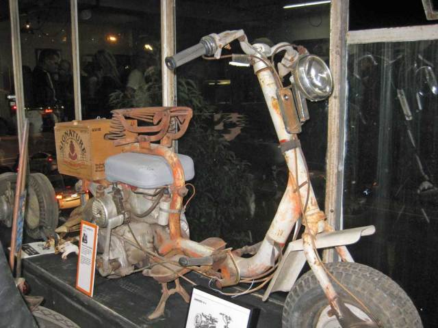 A scooter in the window